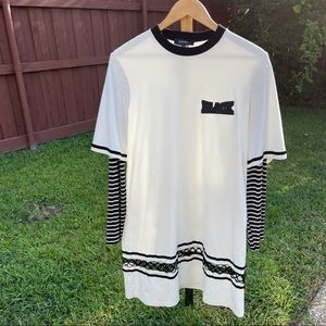 Black striped tunic with the softest material. Fits S-L.